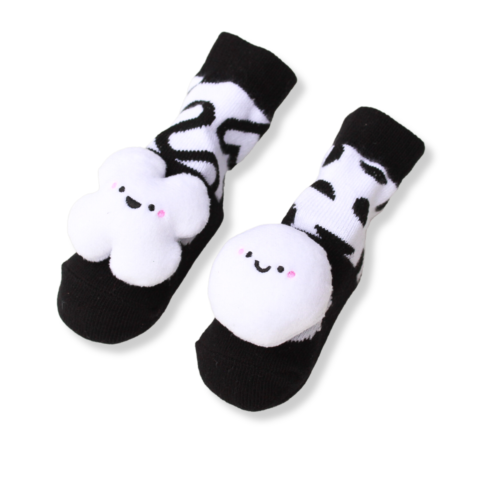Black and white baby booties from the Newborn toy box subscription Little Dreamer Box from Little Bloomer